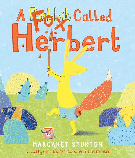 The book cover for A Fox Called Herbert shows a yellow rabbit with a fox tail holding an orange paint brush where they have painted "Fox" in the title over the word "Rabbit".