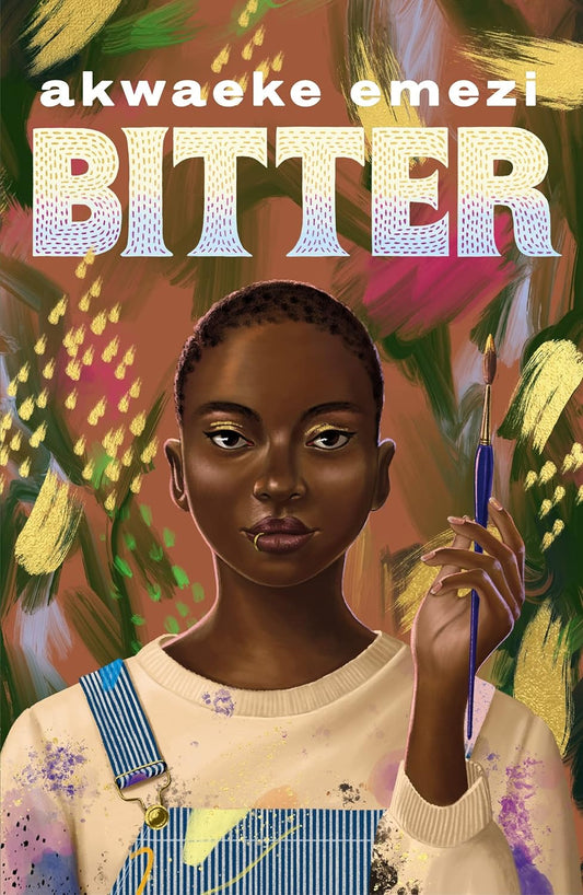 The book cover for Bitter shows a young black girl with a shaved head wearing a paint splattered jumper and dungarees. She holds a paintbrush in her left hand and behind her are multiple expressive brush strokes in the colours green, yellow, pink, and blue.