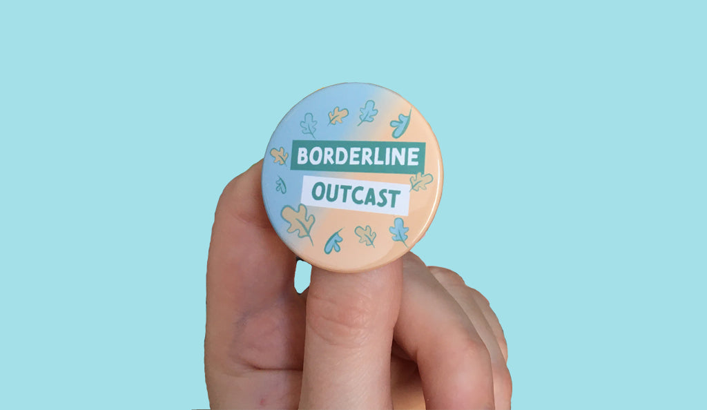 A badge with the text "Borderline Outcast" and blue and peach leaves.