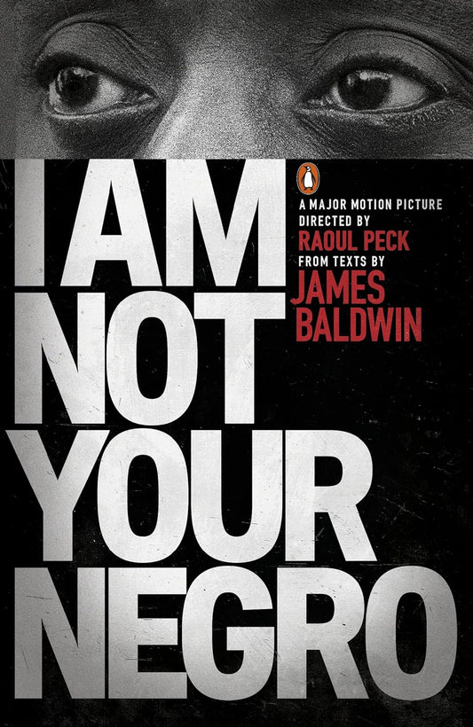 The black book cover for I Am Not Your Negro has the eyes of James Baldwin, a black man known for his incredible writing, at the top of the cover.