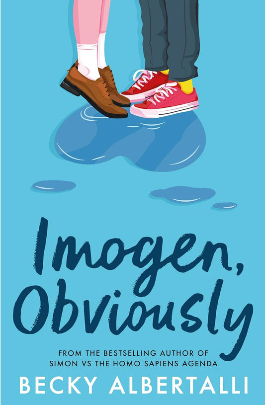 The blue book cover for Imogen, Obviously. We can see from the ankle down two people stood side by side in a puddle of water shaped like a heart.