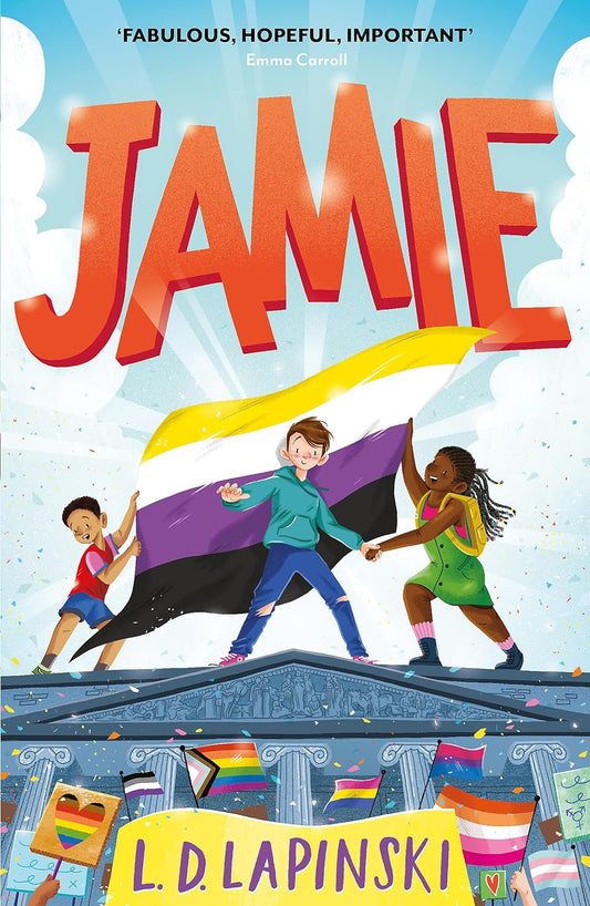 The book cover for Jamie shows three young friends stood on top of a roof with two of the friends holding a non-binary flag. Beneath them is a crowd of people, holding up numerous different pride flags and banners.