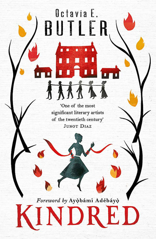 The white book cover for Kindred shows a red building, a plantation, in the background. A line of black people walk in front of it, all chained together. Two branches line either side of the cover with leaves that look like fire  hanging from them. At the bottom of the cover is a black lady, running, with red ribbon wrapped around her arms.