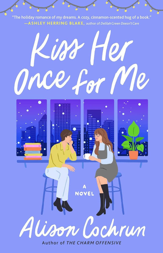 The purple book cover for Kiss Her Once for Me shows two women sat on bar stools in front of a window showing a snowy city skyline.