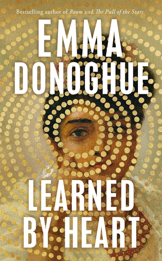 The book cover for Learned By Heart shows the portrait of an Indian lady, with a pattern of small circles centring around her eye and obscuring most of her image.