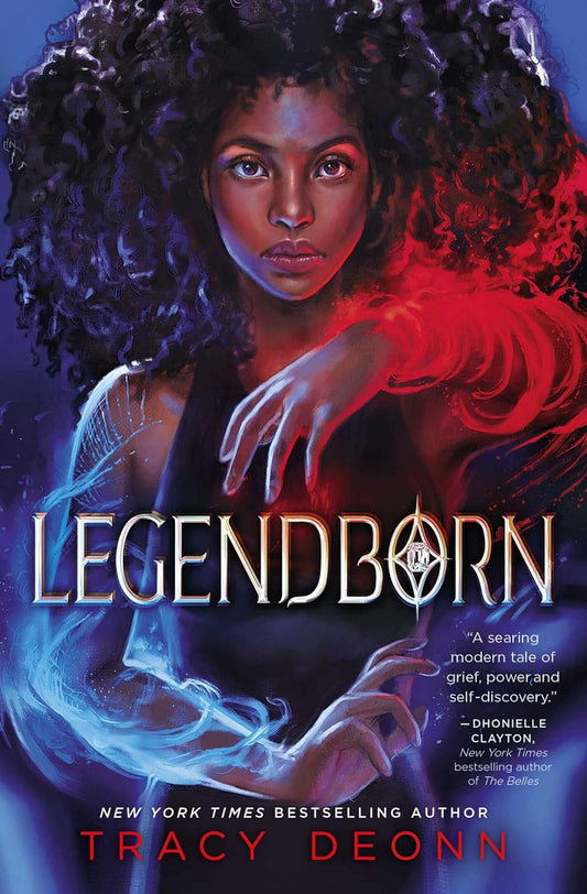 The Legendborn book cover shows a black teen girl in all black wielding magic. Blue magical light wraps around her right arm, red wraps around her left.