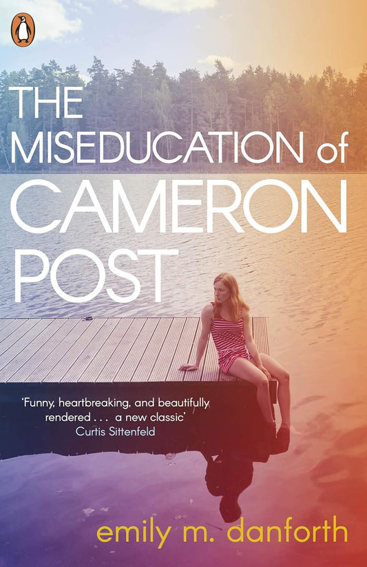 The book cover for The Miseducation of Cameron Post shows a white teen girl sitting on the edge of a dock with her feet in the lake. Trees line the background.