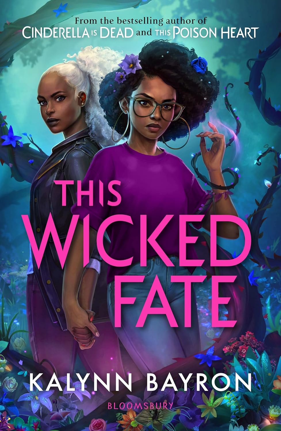 A book cover with two black teenage girls stand side by side holding hands. One has purple magic glowing from her her. Plants of her own creation surround them. The title This Wicked Fate overlays the image in pink.