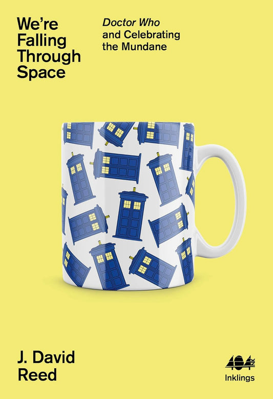 The book cover of We're Falling Through Space has a mug with a TARDIS pattern decorating it.
