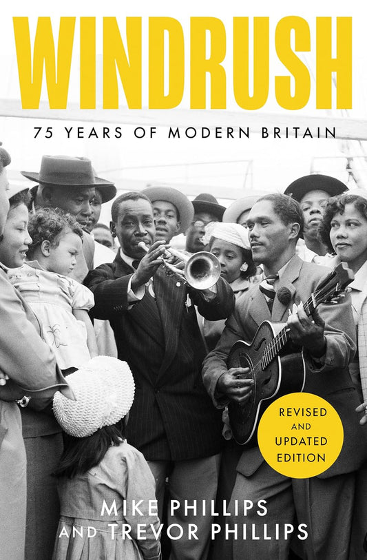 The book cover for Windrush shows a black and white photo of the Caribbean folks from the Windrush generation. Two Caribbean men play instruments while a crowd of people watches them.