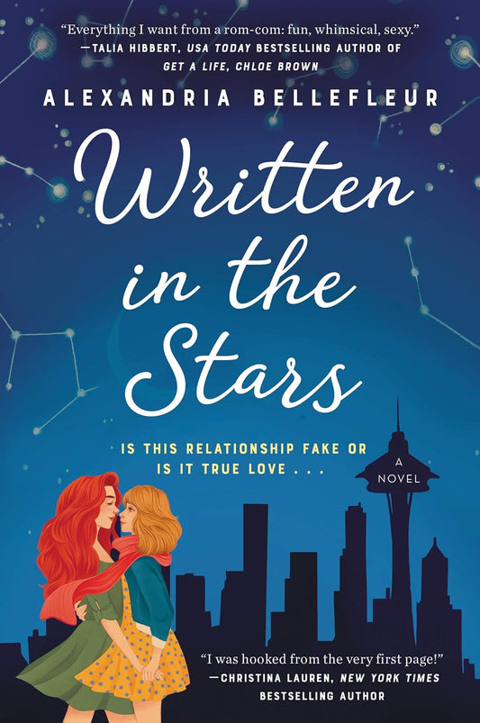 The book cover for Written in the Stars shows a dark sky with constellations shining. Two women embrace each other in front of the Seattle skyline. Yellow text reads "Is this relationship fake or is it true love?"